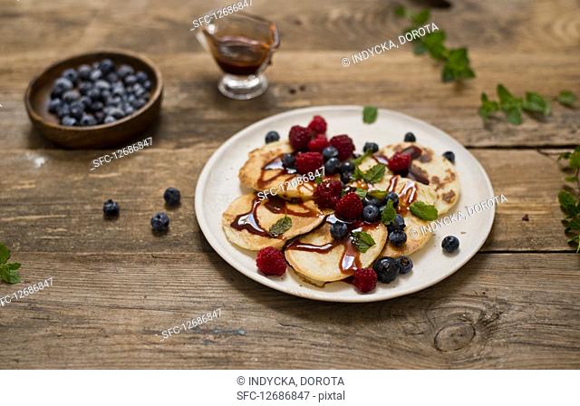Pancakes with date syrup and berries