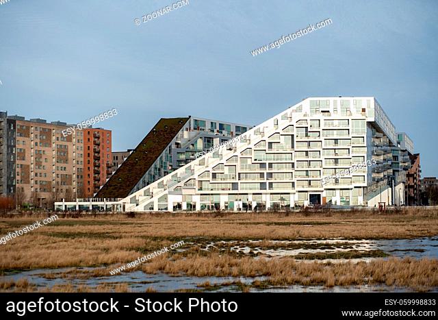 Copenhagen, Denmark - January 05, 2020: Exterior view of the 8 Tallet building, designed by famous Danish architect Bjarke Ingels