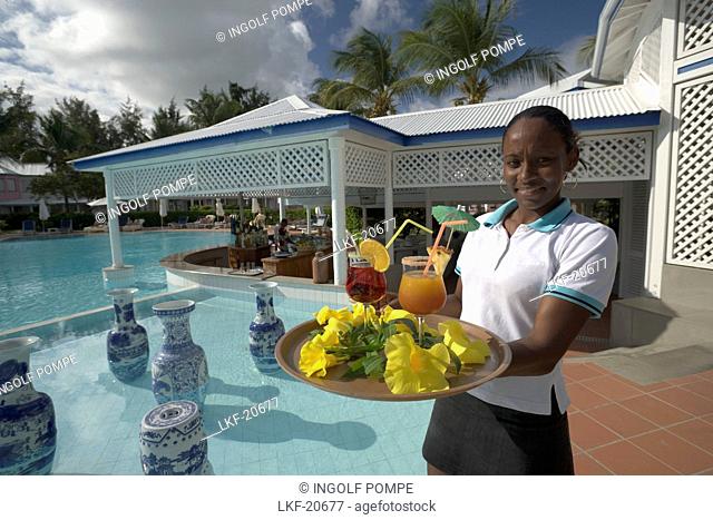 Waitress serving Planters Punch at Hotel La Cocoteraie, Le Meridien, Saint-Francois, Guadeloupe, West Indies