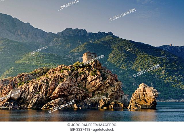 The Genoese Tower of Porto on top of a rocky hill and the Gulf of Porto