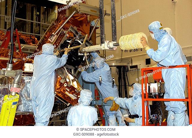 01/29/2002 - Workers in the Vertical Processing Facility check the position of the Hubble Space Telescope's replacement Reaction Wheel Actuator on the Large...