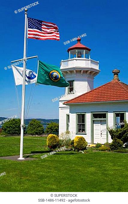 American flag fluttering in front of a lighthouse, Mukilteo Lighthouse, Mukilteo, Snohomish County, Seattle Metropolitan Area, King County, Washington State