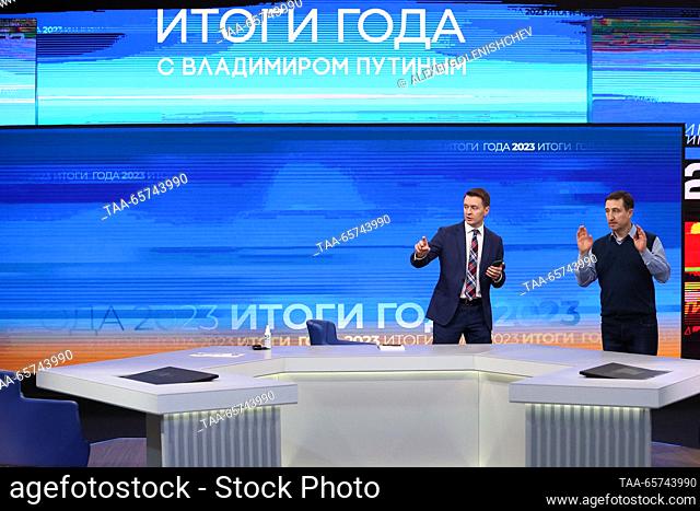 RUSSIA, MOSCOW - DECEMBER 14, 2023: Final touches are made to the venue of an annual national live televised question-and-answer session and press conference by...