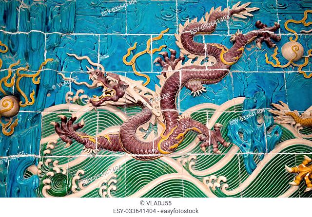 Dragon sculpture. The Nine-Dragon Wall (Jiulongbi) at Beihai park, Beijing, China. The wall was built in 1756 CE