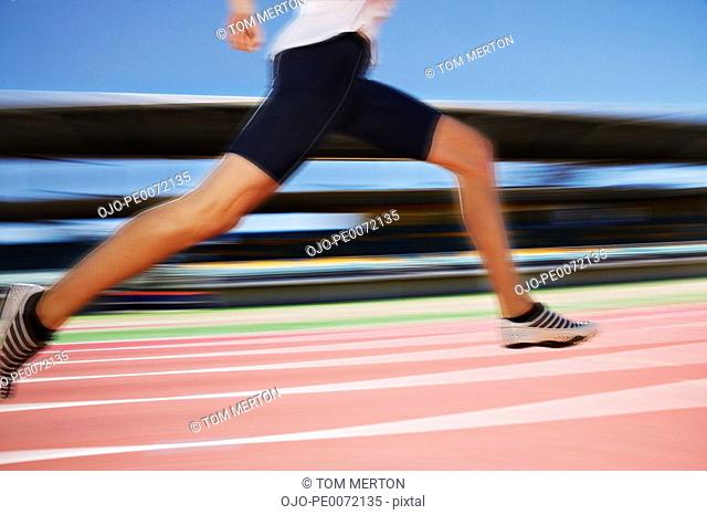Runner sprinting on track
