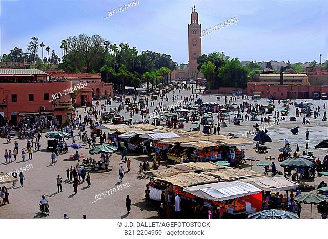 Djema El Fna square and Koutoubia tower in background, Marrakech, Morocco