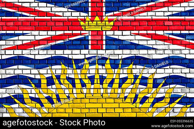 flag of British Columbia painted on brick wall