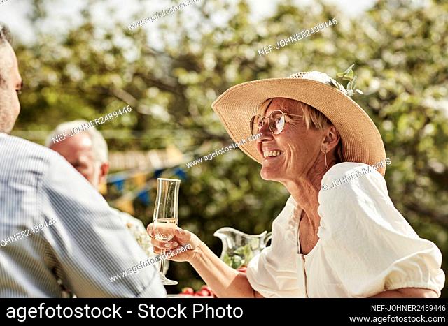 Woman smiling at party in garden