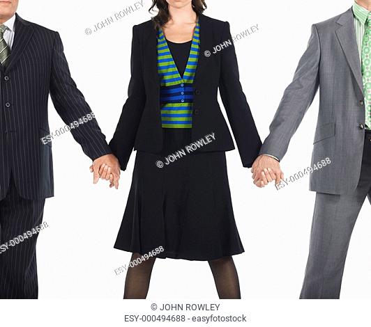 Three businesspeople holding hands
