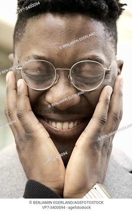 happy African man giggling