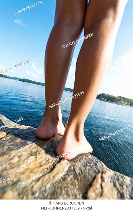 Person standing at edge of cliff