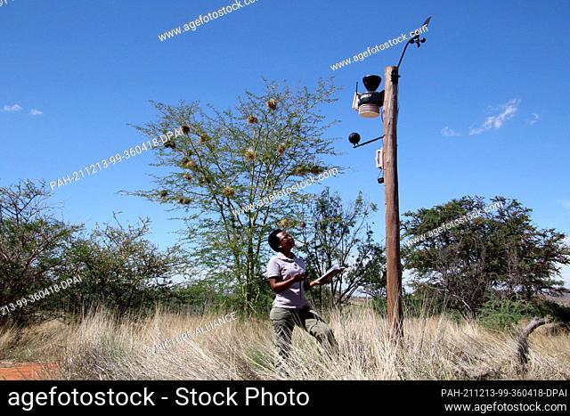 PRODUCTION - 05 December 2021, South Africa, Kalahari: Animal conservation physiologist Keafon Jumbam, who is studying the impact of climate change on the...
