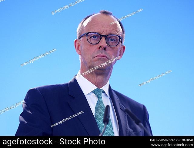 02 May 2022, North Rhine-Westphalia, Cologne: Friedrich Merz, CDU party chairman, follows a press conference after the joint executive committee meeting of the...