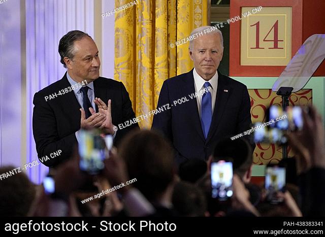United States President Joe Biden hosts a Hanukkah reception at the White House in Washington, U.S., December 11, 2023. Second gentleman Doug Emhoff looks on...
