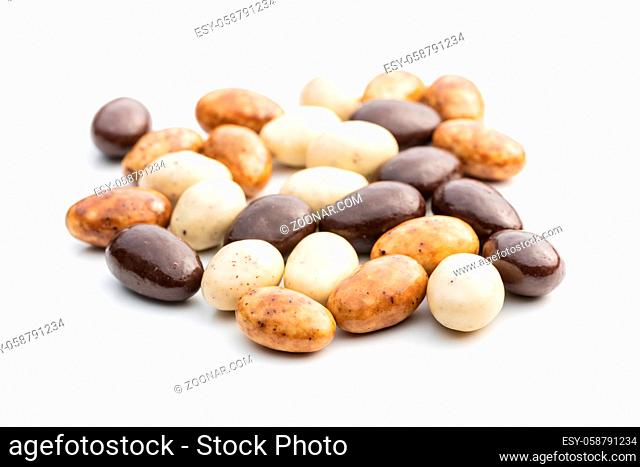 Sweet chocolate almonds. Chocolate eggs isolated on white background