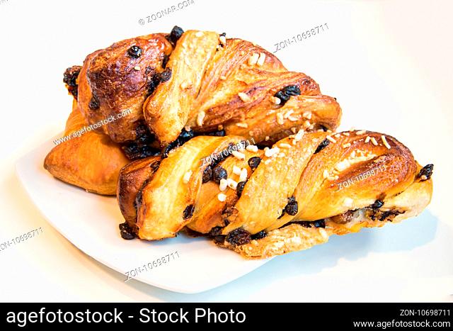 Italian croissants isolated on white plate and white background, close-up