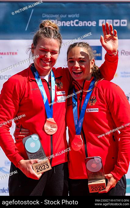 27 August 2023, North Rhine-Westphalia, Duisburg: Canoe: World Championship, final, kayak two-man, 500m, women. Paulina Paszek (r) and Jule Hake present their...