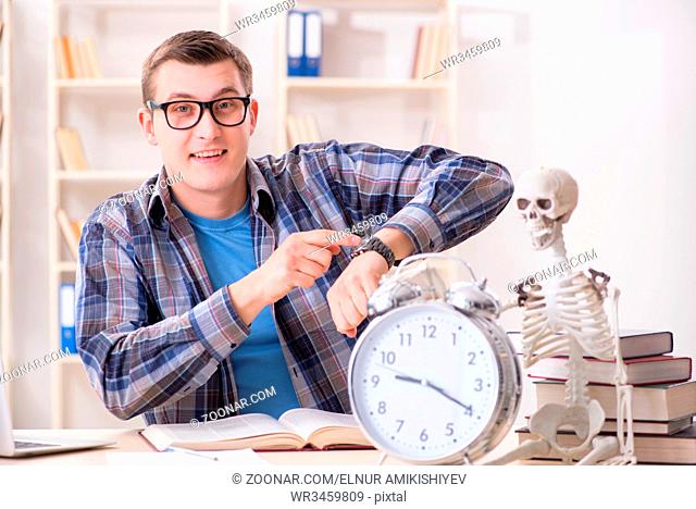 Student and skeleton preparing for school exams