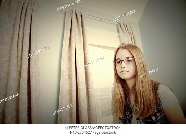 Teenage girl wearing glasses
