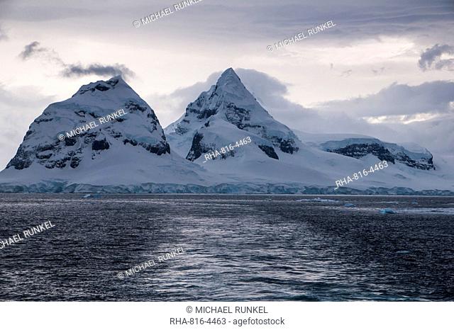 Dark clouds over the mountains and glaciers of Port Lockroy research station, Antarctica, Polar Regions