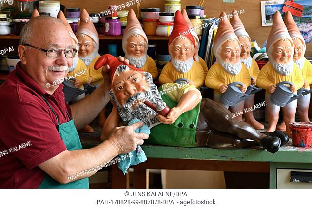 CEOÂ Reinhard Griebel paints gnomes at the garden gnome manufactory in Graefenroda, Germany, 25 August 2017. More than 500 different figures between four and 60...