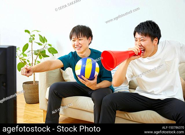 Japanese people cheering from home