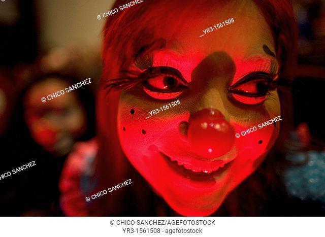 A female clown smiles during the 16th International Clown Convention: The Laughter Fair organized by the Latino Clown Brotherhood, in Mexico City, October 17