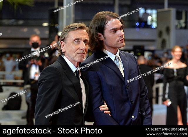 11 July 2021, France, Cannes: Tim Roth and his son Michael Cormac Roth attend the screening of the film ""Bergman Island"" during the 74th Annual Cannes Film...
