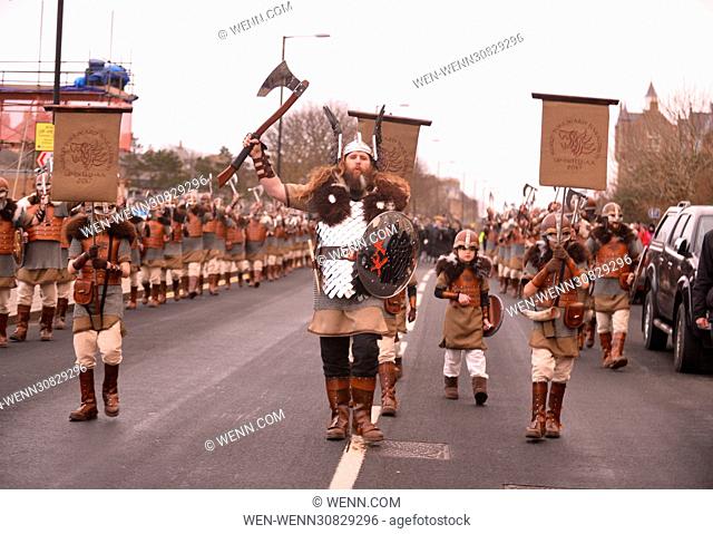 The Guizer Jarl and his squad march from the Islesburgh Community centre to join the Galley (longship) at the Lerwick Royal British Region to parade through the...
