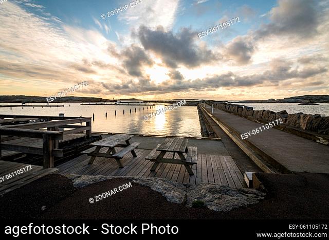 Early morning. Benches in front of the sea, with Faerder National Park in the background, view from Verdens Ende in Vestfold Norway