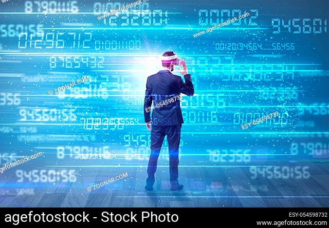 Businessman in vr glasses with variable fast changing numbers around