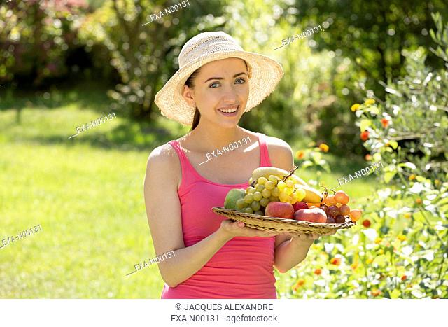 Woman offering fruits