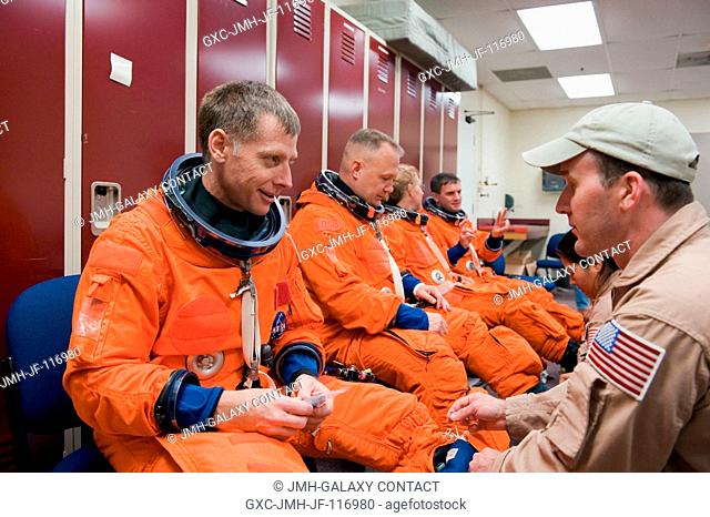 NASA astronauts Chris Ferguson (left foreground), STS-135 commander; Doug Hurley, pilot; Sandy Magnus and Rex Walheim, both mission specialists