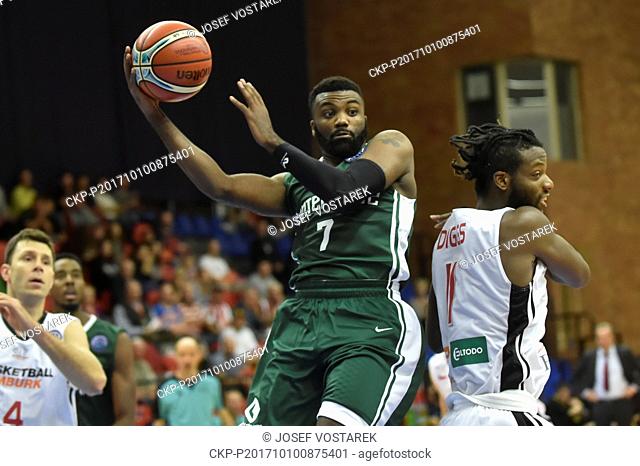 Jamal Shuler of Nanterre, center, Quincy Diggs of Nymburk, right, and Petr Benda of Nymburk, left, in action during the Champions Basketball League group D...