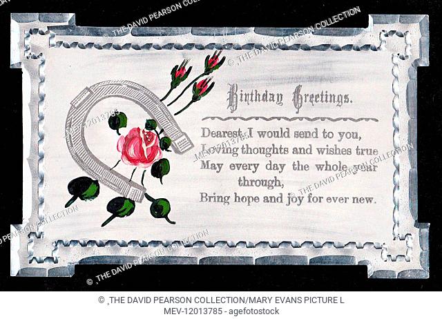 Pink roses and buds with horseshoe on a birthday greetings card made of metal