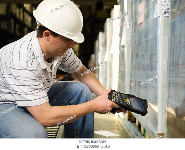 Warehouse worker scanning shipments