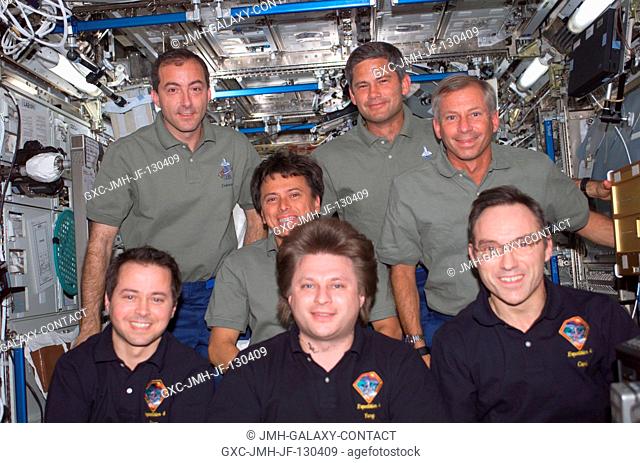 The Expedition Four (front row) and STS-111 crews assemble for a group photo in the Destiny laboratory on the International Space Station (ISS)