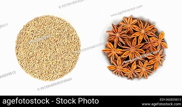 Anise and Star anise fruits and seeds, in white bowls. Pimpinella anisum, also aniseed or anix in the left bowl, and the unrelated llicium verum, also staranise
