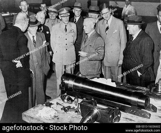 General J.C. Smuts pauses to look at mass-produced Howitzer barrel during a tour of the great Rand Munition factories in South Africa