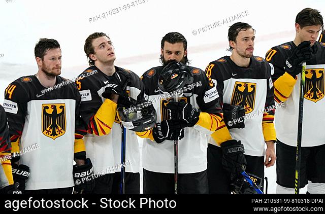 31 May 2021, Latvia, Riga: Ice hockey: World Championship, preliminary round, group B, USA - Germany: Disappointed German players after the final score of 0:2...