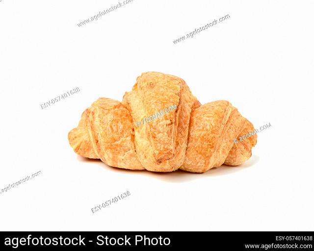 baked croissant made from white wheat flour isolated on white background, close up