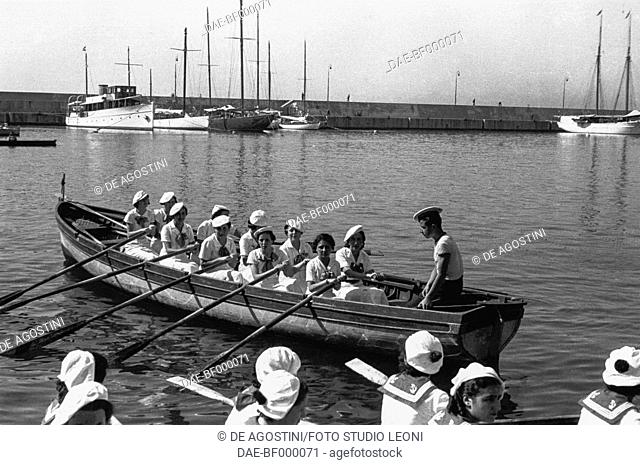 Female crew on rowing boats, celebration in honor of Simone Boccanegra first Doge of Genoa, June 26, 1936, Genoa, Italy, 20th century