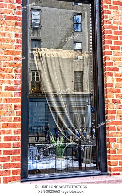Looking at a Restaurant Window and Curtain on the Inside and Street reflections on the Outside. New York City, Manhattan, Tribeca