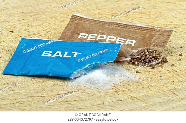 Open salt and pepper sachets