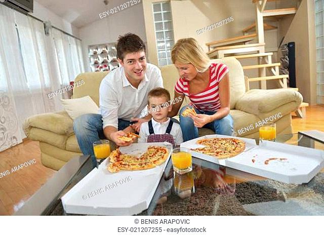 family eating pizza