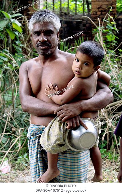 Father holding Son On Waist ; Bangladesh