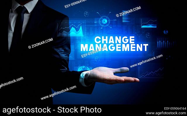 Hand of Businessman holding CHANGE MANAGEMENT inscription, business success concept