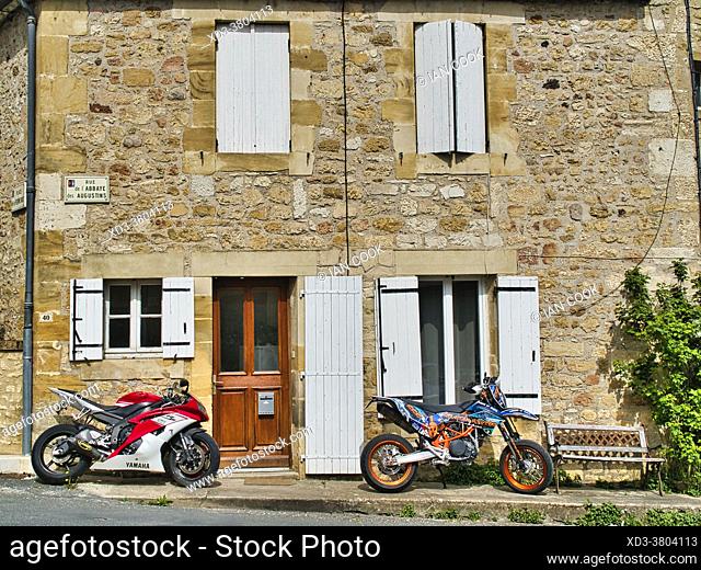 motorcycles parked in front of a blonde sandstone house, Saint-Cyprien, Dordogne Department, Nouvelle-Aquitaine, France
