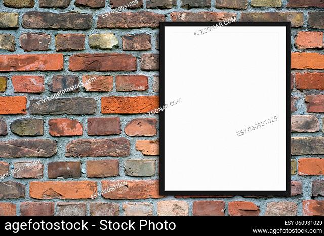 empty picture frame mock-up and copy space on brick stone wall background