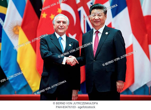 Michel Temer, the new President of Brazil, being welcomed by Chinese President Xi Jinping (r) at the G20 summit in  Hangzhou, China, 4 September 2016